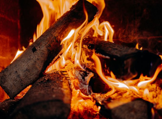 Lighting the fireplace with wood 